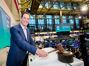 rogers ceo at nyse closing bell with gavel